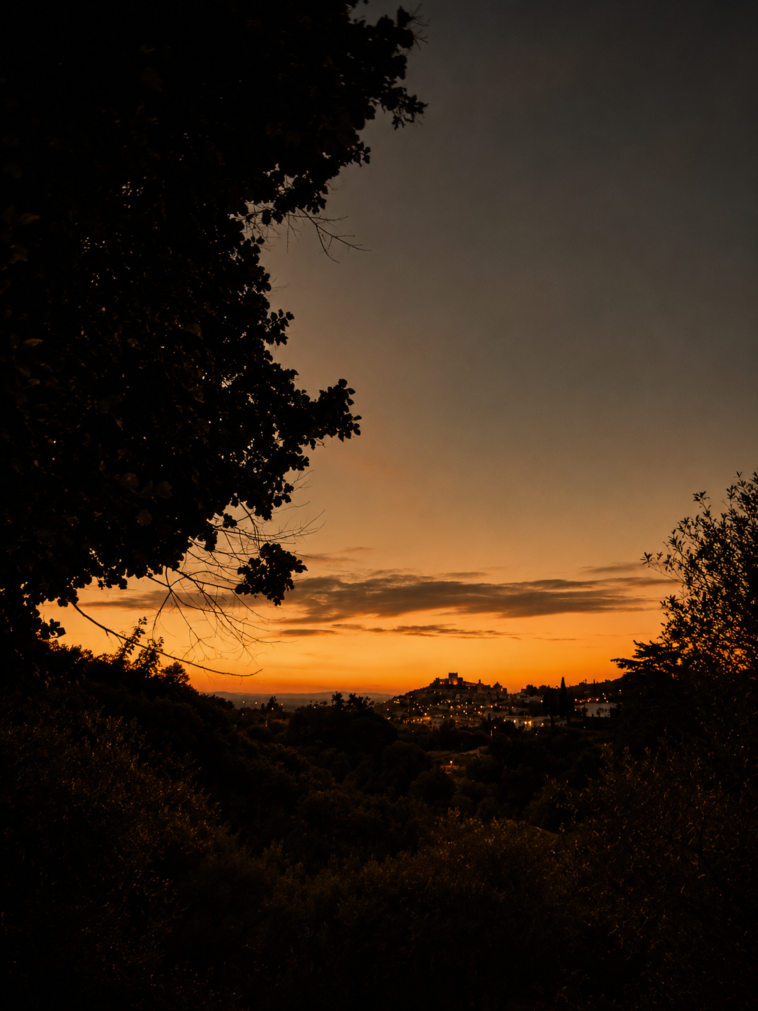 Silhouette of Castelo de Vide on its hilltop at dusk